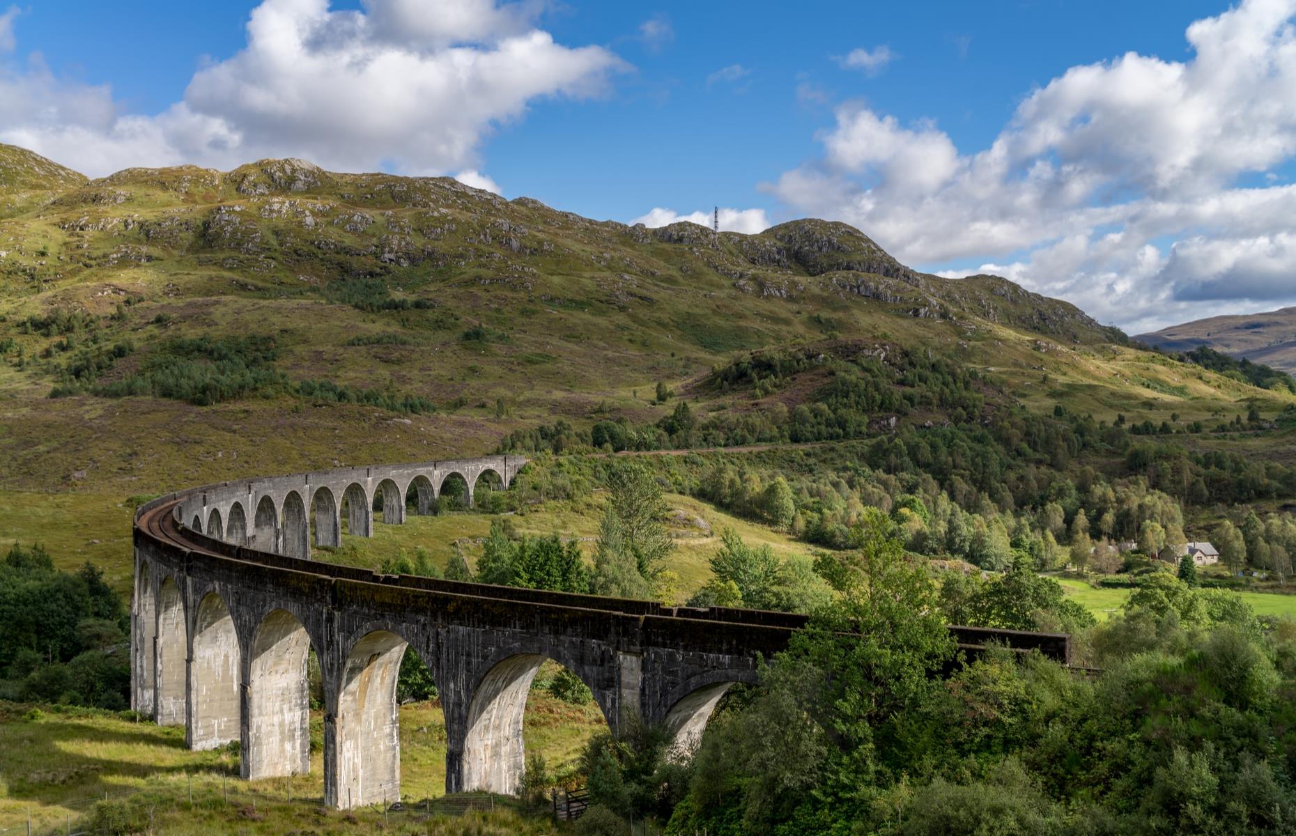 <p>The stunning 100-foot (30m), 21-arch viaduct in the Harry Potter films isn’t clever CGI trickery either. It would be hard to imagine a more beautiful natural setting for the sweeping Glenfinnan Viaduct than Loch Shiel and the surrounding green rolling hills of the Scottish Highlands.</p>