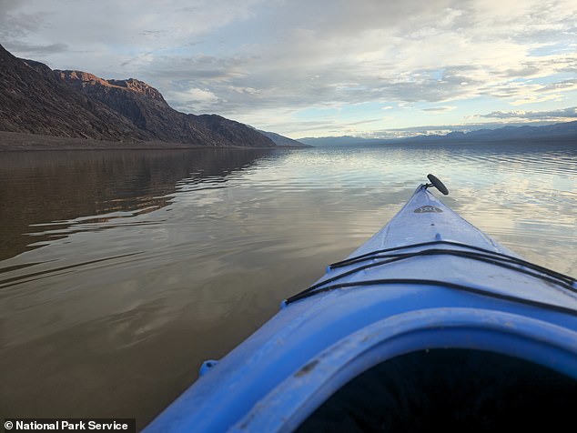 death valley comes to life: 'once in a lifetime' storms create temporary lake at california hot spot with one now deep enough to kayak in