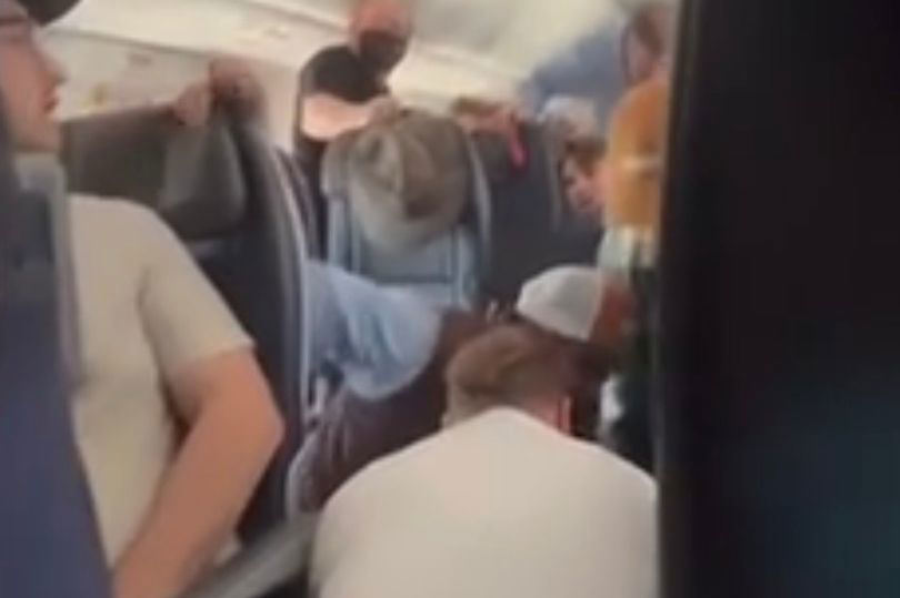 American Airlines Emergency After Wild Passenger Attempts To Open Door Mid Flight