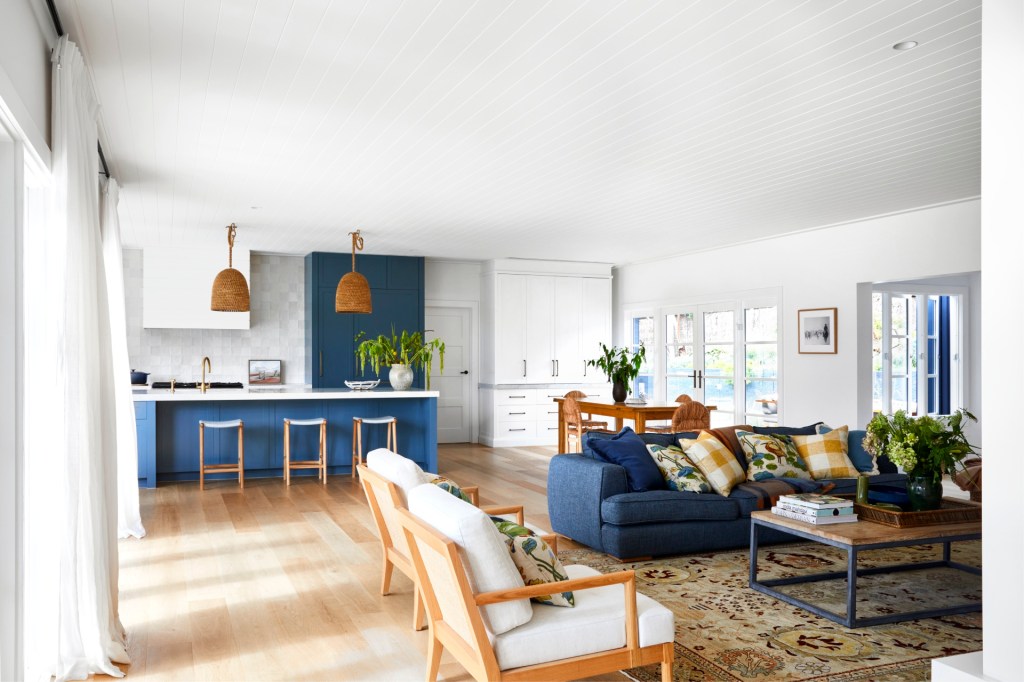 a refreshing and bold blue colour palette ties this home to its coastal locale