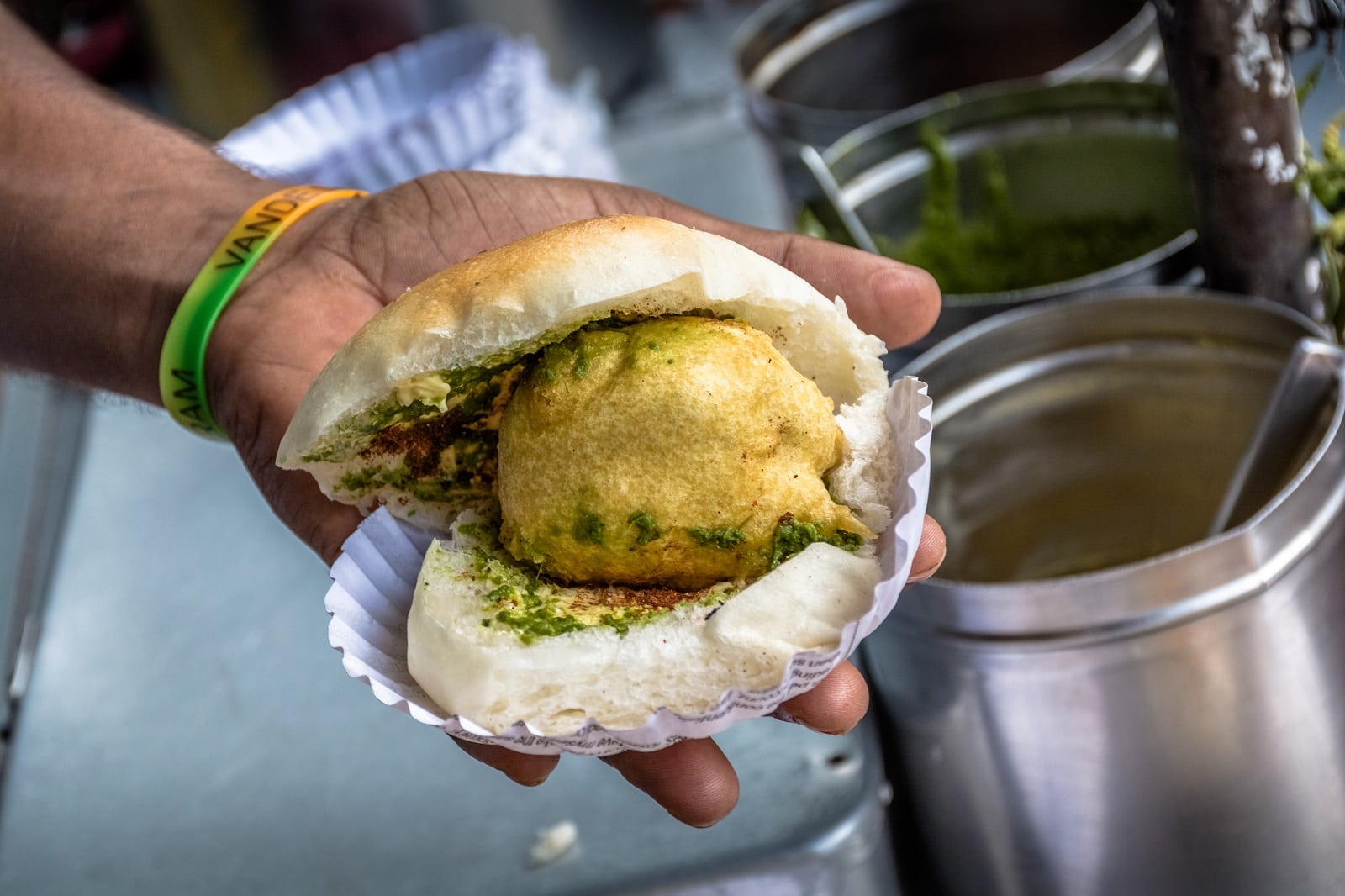 <p><span>Mumbai’s Vada Pav is an irresistible street snack reminiscent of a spicy potato fritter burger. Found at nearly every street corner, especially around Chowpatty Beach, this simple yet flavorful dish consists of a deep-fried potato dumpling placed inside a soft bread bun (pav), served with spicy green chutney and garlic powder. It’s a beloved comfort food among locals, offering a taste of authentic Mumbai.</span></p> <p><b>Insider’s Tip: </b><span>Pair it with a cup of cutting chai.</span></p> <p><b>When To Travel: </b><span>November to February for pleasant weather.</span></p> <p><b>How To Get There: </b><span>Fly to Mumbai’s Chhatrapati Shivaji Maharaj International Airport.</span></p>