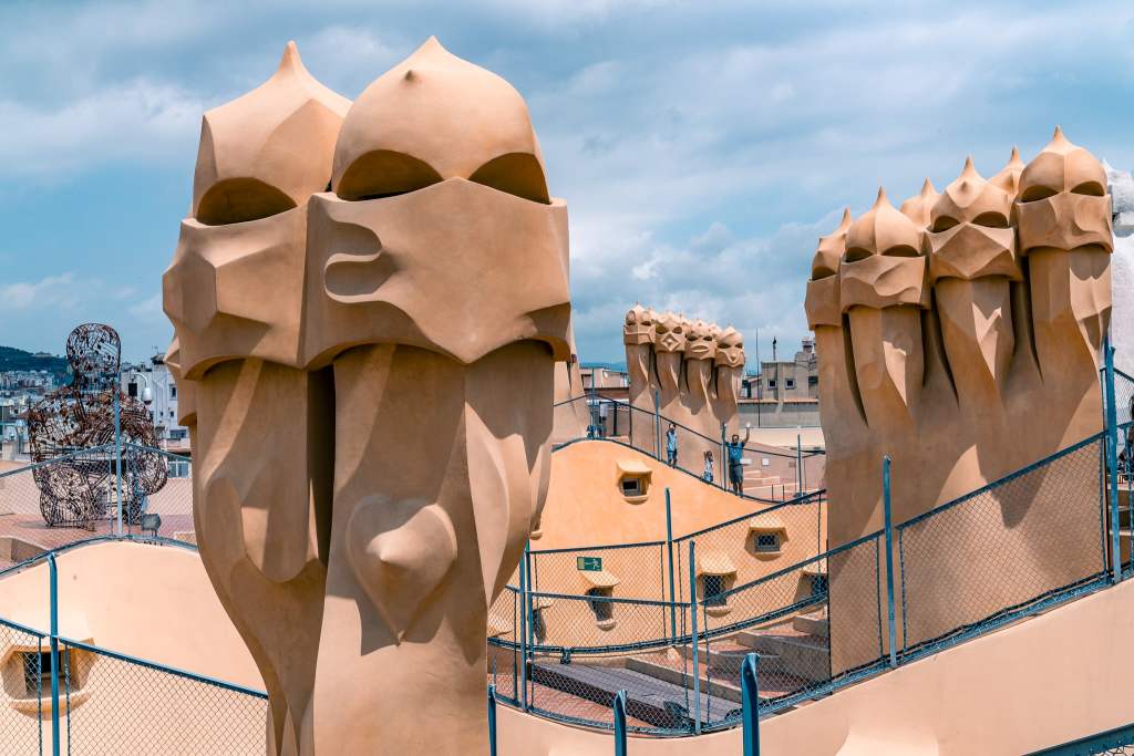 <p><a href="https://www.getyourguide.com/casa-mila-l3038/skip-the-line-casa-mila-ticket-with-audio-guide-t49864/?partner_id=3868NZ7&utm_medium=online_publisher&cmp=barcelona_">Casa Milà</a>, also known as La Pedrera, is a unique building in Barcelona. The interior of the building is like a living museum where one can witness the architectural and design elements from a bygone era. </p><p>However, the real attraction is the rooftop, which is adorned with intricate details and fascinating sculptures. It’s a great experience to walk around the statues on the top floor, though there is usually a line for the elevators. </p><p>One can either choose to wait in the line or climb six floors to reach the top. Similarly, while coming down, there is another line for the elevator, but one can opt for the stairs to make it a bit easier.</p><p class="has-text-align-center has-medium-font-size">Read also: <a href="https://worldwildschooling.com/unique-places-for-your-european-bucket-list/">Unique Places for Your European Bucket List</a></p>
