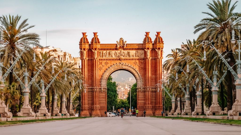 <p>In the center of Barcelona stands the Arc de Triomf, a beautiful arch built in the Neo-Mudéjar style using reddish brickwork. Created by Josep Vilaseca i Casanovas for the 1888 Barcelona World Fair, this impressive structure originally served as the grand entrance to the event. </p><p>Nowadays, it stretches proudly over the Passeig de Lluís Companys, leading visitors towards Ciutadella Park. A symbol of Catalan heritage, it’s a must-see for anyone exploring the city.</p><p class="has-text-align-center has-medium-font-size">Read also: <a href="https://worldwildschooling.com/europes-best-value-beach-destinations/">Europe’s Best Value Beach Destinations</a> </p>