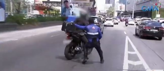 mmda enforcer nearly dragged by rider who tried to flee on edsa busway