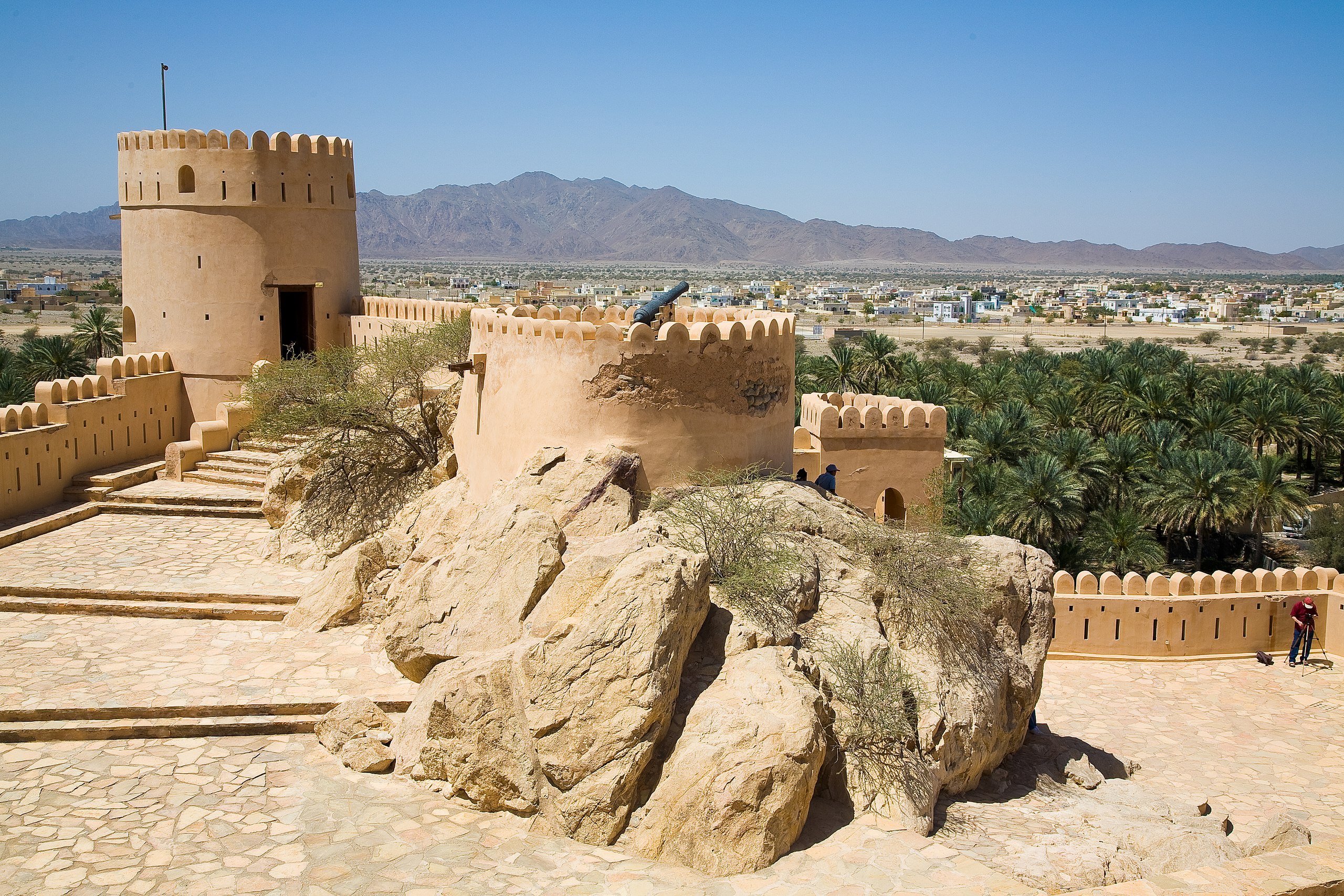 <p>Nakhal Fort immediately catches the eye for its unusual shape. <strong>Predating the Islamic era</strong>, the castle was originally built around a large boulder near the base of Mount Nakhal. </p>  <p>Initially, the fort was built to protect trade routes, but over time, a mosque, reception halls, and residential quarters were added to the complex.</p>
