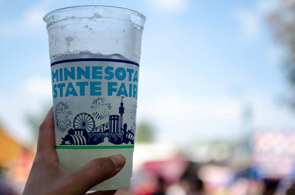 <p>The Minnesota State Fair is the largest in the country based on daily attendance, and it’s also known as the “Great Minnesota Get-Together.” Spread out over more than 320 acres, this is the place to find just about every <a href="https://xoxobella.com/state-fair-foods/">state fair food</a> you can think of fried and on a stick. There are also livestock exhibits, and the bust of the Dairy Queen of Minnesota carved out of butter. </p>