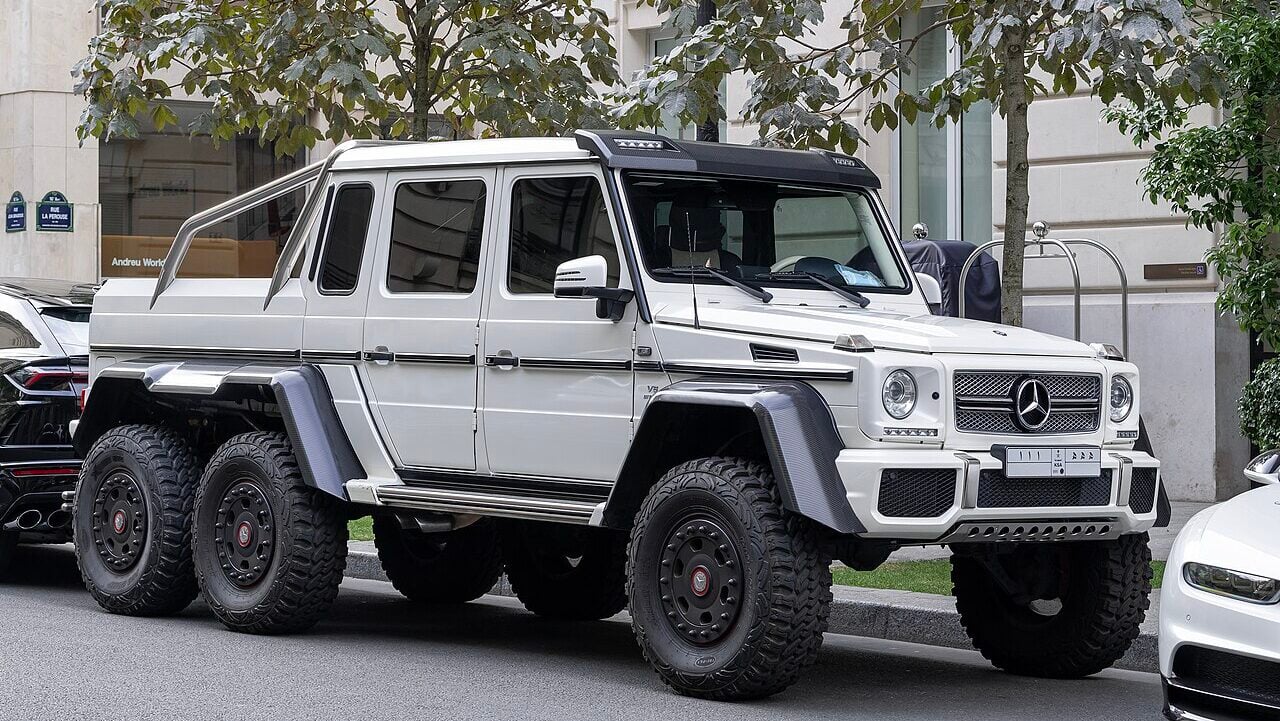<p>By now, practically every gearhead knows about the ostentatious Mercedes-Benz G63 AMG 6×6. Basically, they added another rear axle and upped the wheel count to six, and it became a popular vehicle for tearing up Middle Eastern deserts.</p><p>The G63 AMG 6×6 weighs nearly 8,500 lbs, but it’s no slouch thanks to a twin-turbocharged 5.5-liter V8 that sends 536 horses and 560 lb-ft of torque to all six wheels.</p>
