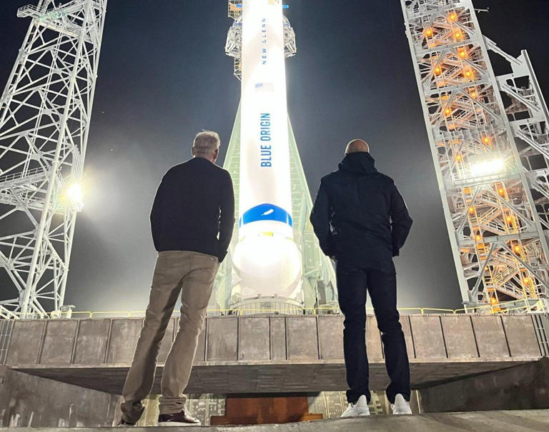Blue Origin CEO Dave Limp and founder Jeff Bezos get a look at New Glenn. (Blue Origin via LinkedIn)