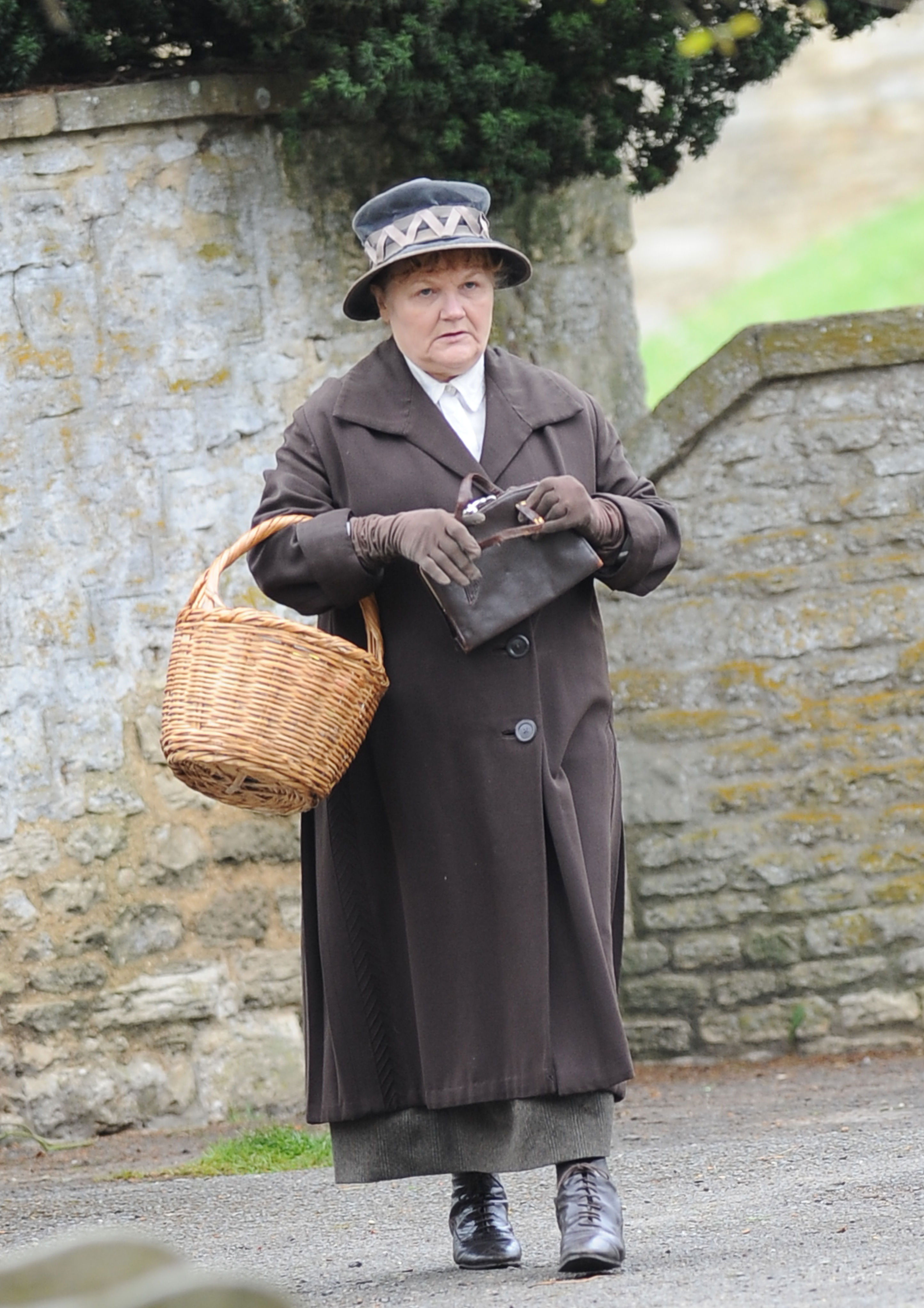 <p>Here's Downton Abbey's cook, Mrs. Patmore (Lesley Nicol), in early 20th century street clothes while filming the PBS series in Oxfordshire, England, in 2014.</p>