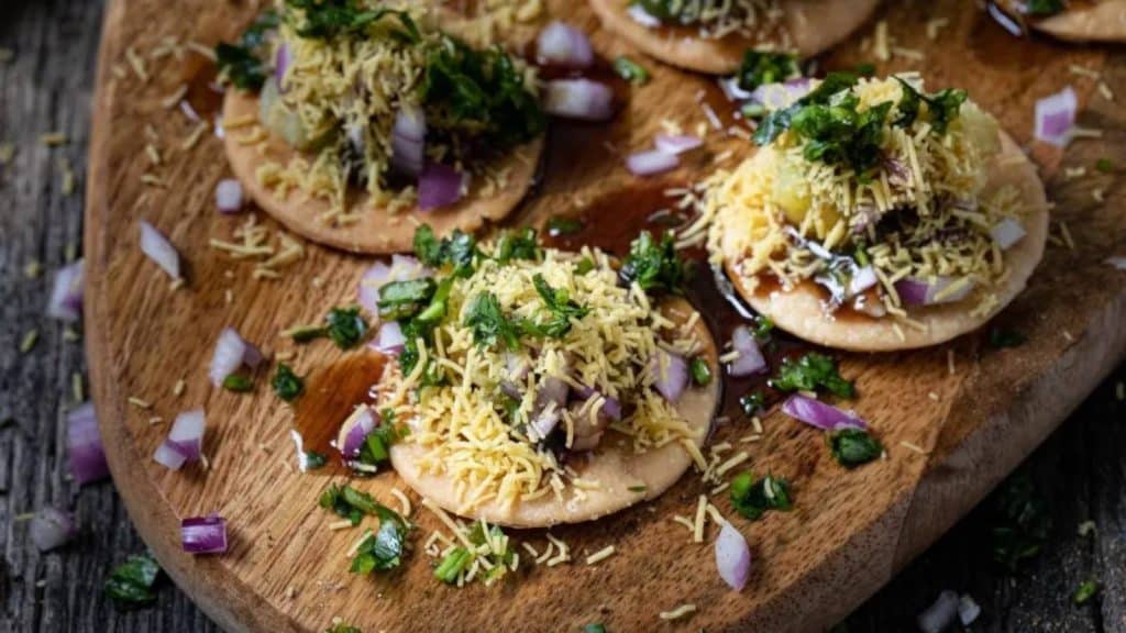 <p>Sev Puri is a classic Bombay street food with delightful flavors and textures. The interplay of two classic chaat chutneys adds to the taste adventure – the tangy tamarind sweet and sour chutney beautifully contrasts with the refreshing coolness of the cilantro-mint chutney. </p><p><strong>Get the recipe:</strong> <a href="https://indiaphile.info/sev-puri/">Sev Puri</a>.</p>