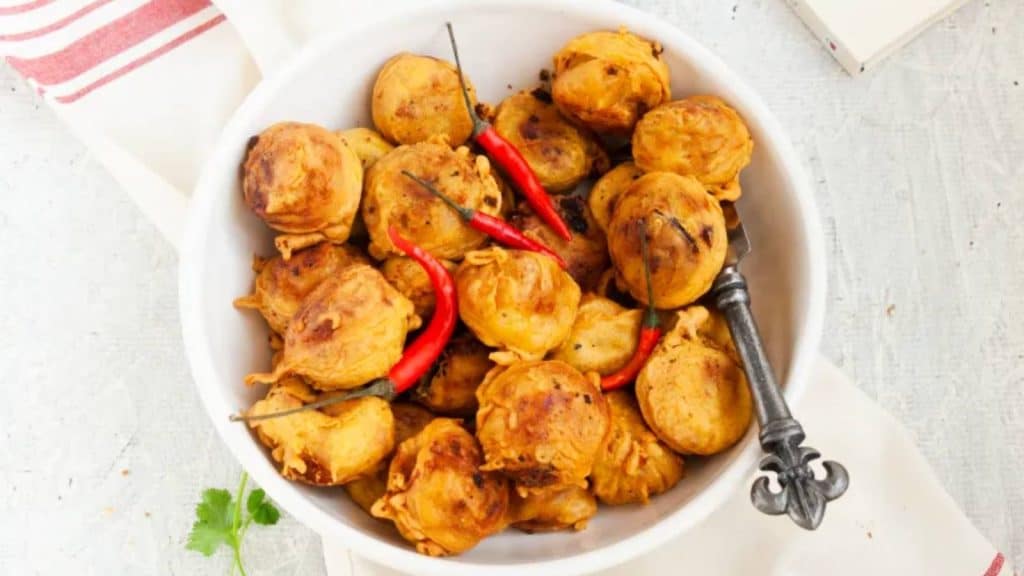 <p>A simple Niramish street food recipe from Odisha that anyone can follow. Seasoned mashed potato balls dipped in chickpea flour/besan batter and then deep-fried to perfection. Enjoy these slightly crispy cutlets, crispy from the outside and soft from the inside, as your evening snack with tea or coffee.</p><p><strong>Get the recipe:</strong> <a href="https://myyellowapron.com/aloo-chop-recipe-oriya-style/">Aloo Chop</a>.</p>