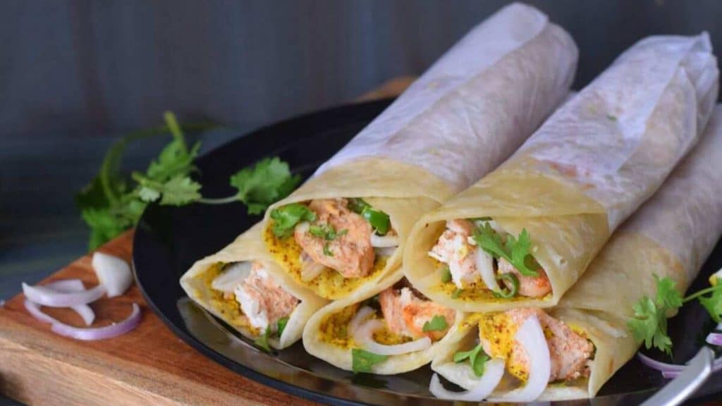 <p>Chicken Kathi Roll is a popular Indian street food made with juicy chunks of chicken kebabs, freshly sliced onions, green chilies, coriander leaves, and mustard sauce rolled in soft, flaky parathas. Kati roll, also known as Kathi, has its roots in Kolkata. Hence, it is also known as the Kolkata Chicken Roll.</p><p><strong>Get the recipe:</strong> <a href="https://motionsandemotions.com/chicken-kathi-roll-kolkata-chicken-roll/">Chicken Kathi Roll</a>.</p>