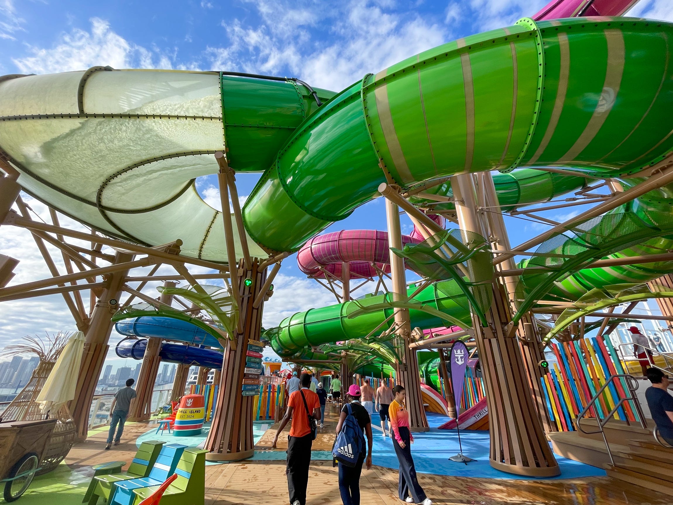 <p>The twisting slides hang overhead like bright tree vines while children rapidly zig-zag around the course like their afternoon fun depends on it (it does).</p>