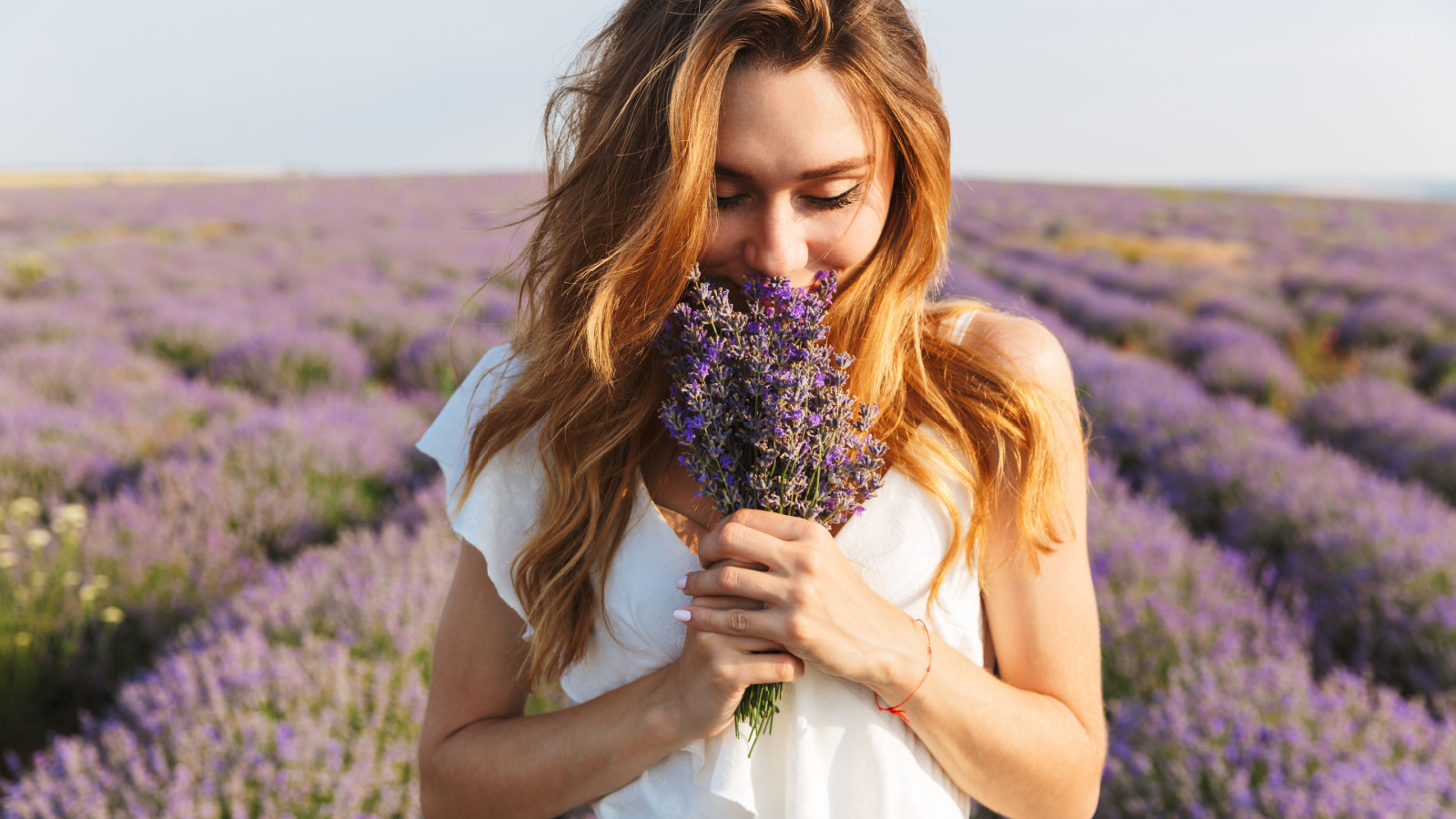 image credit: Dean Drobot/Shutterstock <p><span>Lavender’s floral fragrance carries you into a serene landscape, where each breath becomes a note in a symphony of relaxation. As you inhale deeply, the scent wraps around your thoughts like a soft, velvety blanket, easing away the day’s stress. The room fades, and you find yourself wandering through a blooming lavender field, each step grounding you further into tranquility. In this state, your meditation deepens, cradled by the gentle embrace of lavender’s calming essence.</span></p>