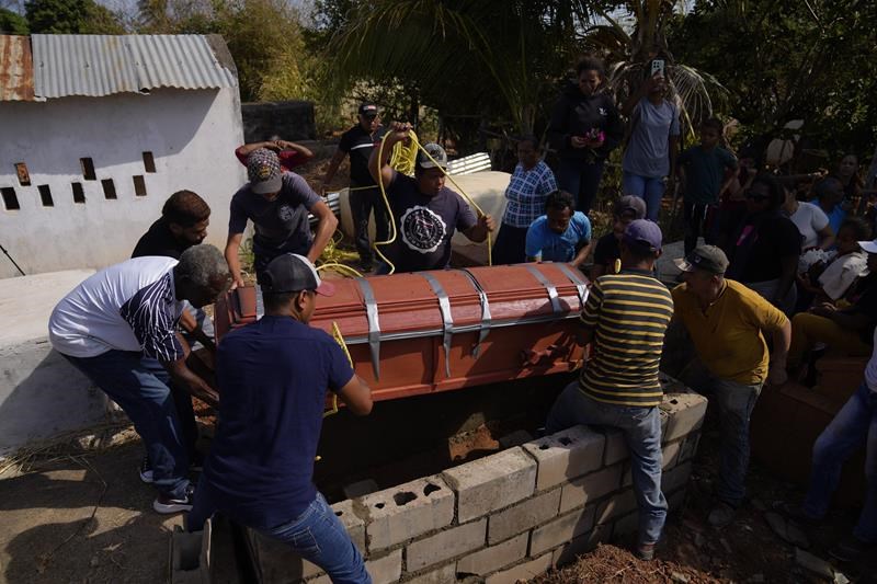 families bid farewell to miners killed in venezuela's worst mining accident in years