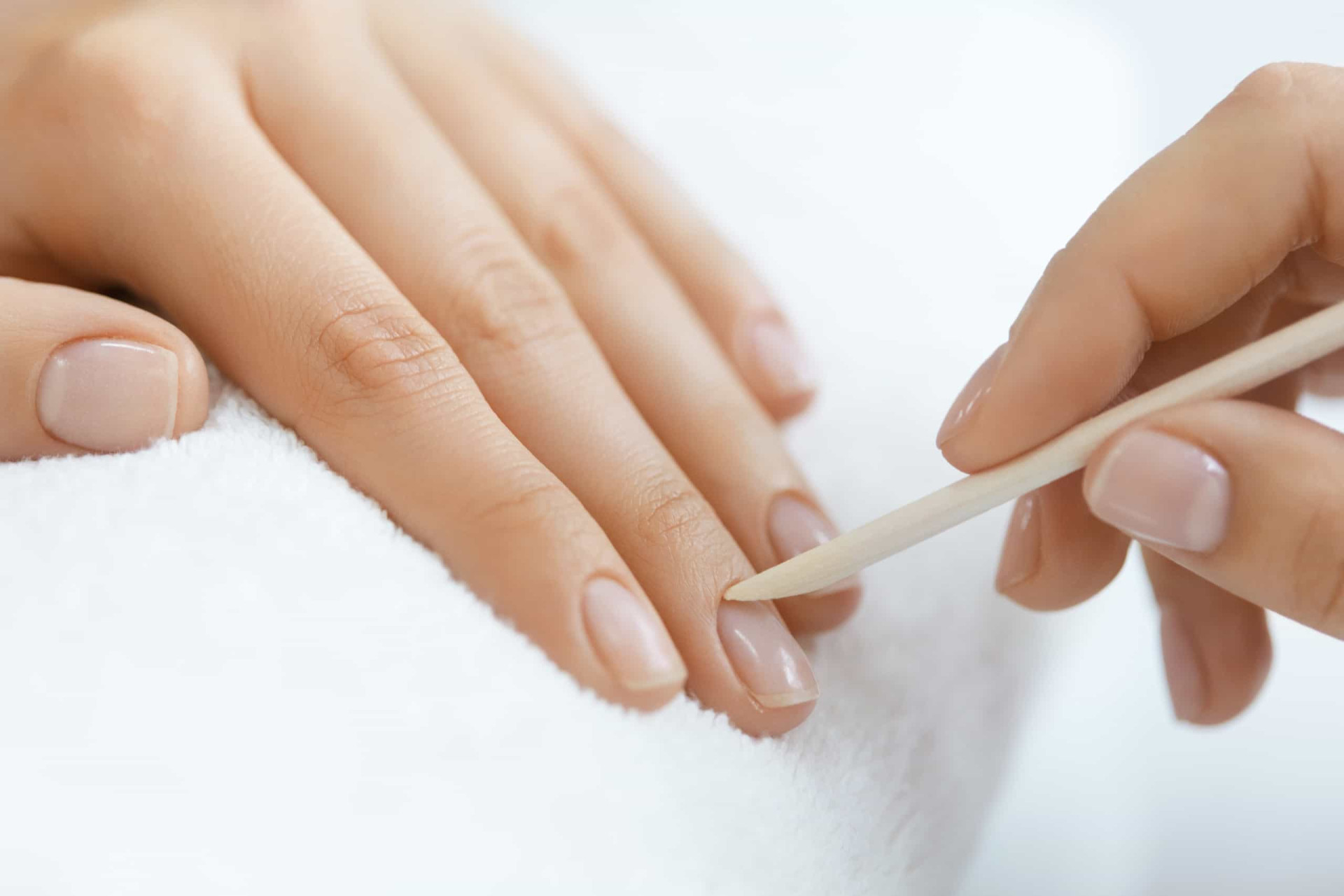 <p><span>Using a cuticle pusher or orange stick, gently push back the cuticles on your nails until they are no longer visible. </span></p>