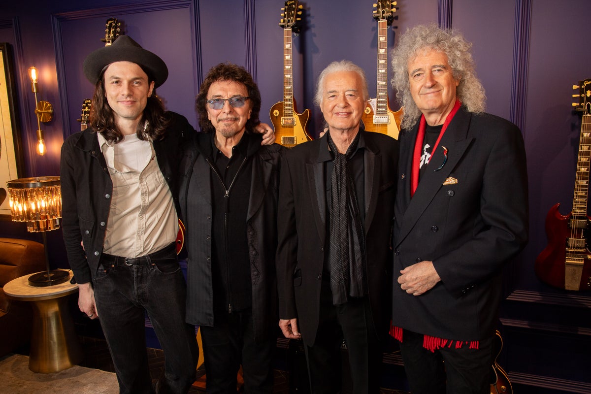 led zeppelin's jimmy page cuts the ribbon on london's brand new gibson garage guitar shop