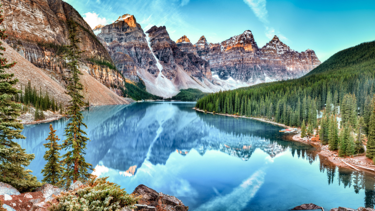 <p>The Canadian Rockies are stunning throughout their entire range, and Banff in Alberta is the heart of it all. Admire the incredible colors of glacier-fed alpine lakes, gape at the towering, glacier-draped peaks, walk out onto the Athabasca Glacier, go on scenic hikes, and more.</p>