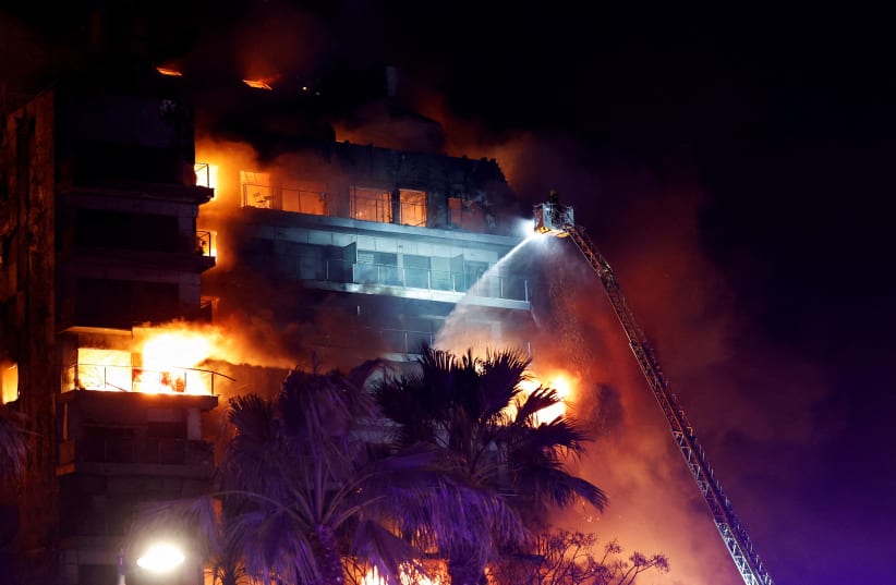 four killed, up to 15 missing in apartment fire in spain