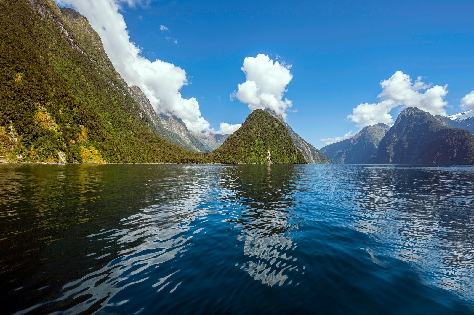 <p><span>Milford Sound, a jewel in Fiordland National Park’s crown, is renowned for its awe-inspiring beauty. With its iconic Mitre Peak, this fjord is a paradise for nature lovers and photographers. A cruise on Milford Sound offers spectacular views of waterfalls, including the famous Stirling and Bowen Falls, and a chance to spot wildlife like seals, dolphins, and penguins.</span></p> <p><span>For the more adventurous, kayaking provides an up-close experience with the fjord’s water and wildlife. The Milford Track, one of New Zealand’s Great Walks, offers an unforgettable hiking experience through stunning landscapes leading to the fjord. </span></p> <p><b>Insider’s Tip: </b><span>Take an early morning cruise to experience the fjord in tranquil conditions.</span></p> <p><b>When To Travel: </b><span>Visit during the shoulder seasons (Spring and Autumn) for fewer crowds.</span></p> <p><b>How To Get There: </b><span>Milford Sound is accessible by road from Te Anau or via scenic flights from Queenstown.</span></p>