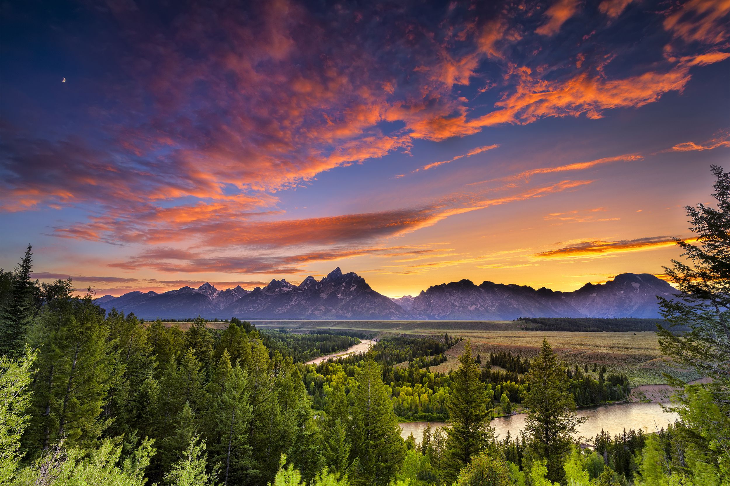 <p>Often visited in conjunction with nearby Yellowstone National Park, <a href="https://www.nps.gov/grte/index.htm">Grand Teton</a> offers 310,000 sweeping acres made up of meadows, lakes, and, of course, the namesake Teton Range. There are also 200 miles of trails here and the Snake River, offering yet another way to take-in this  breathtaking landscape. </p>