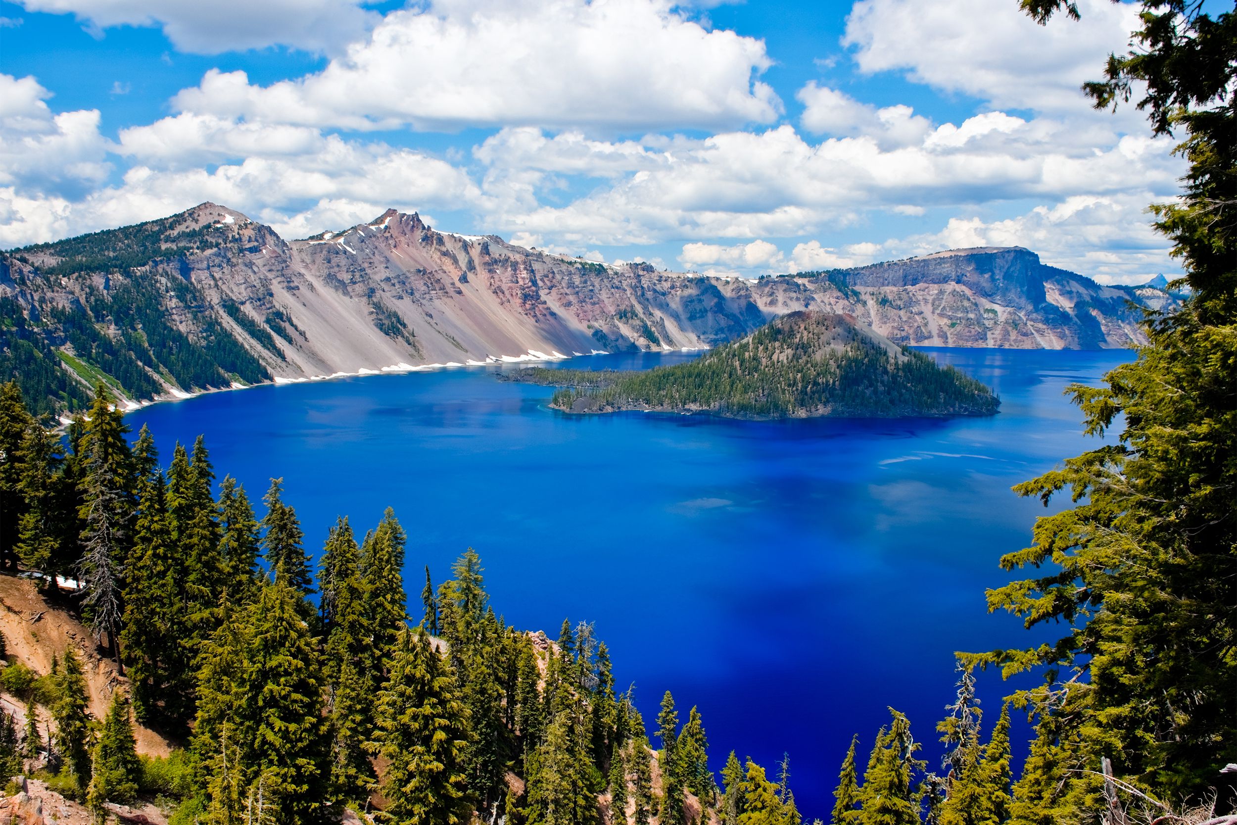 <p>Created some 7,700 years ago through an eruption that caused the collapse of the volcano Mount Mazama, <a href="https://www.nps.gov/crla/index.htm">Crater Lake National Park</a> is home to the deepest lake in the country and one of the most unspoiled in the world. Its stunning jewel-blue waters are simply unforgettable. </p>