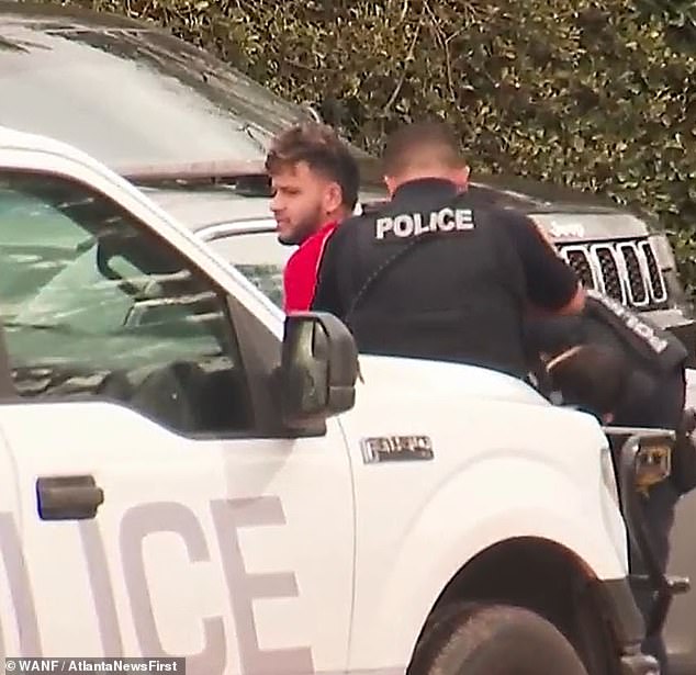 moment georgia nursing student's 'killer' is pinned against cop car, cuffed and arrested near ign campus murder scene: illegal venezuelan migrant is denied bail court hearing