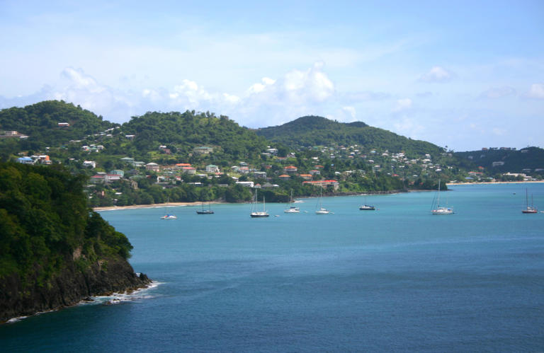 Mountains rise up directly from the shore along the Grenada coast.