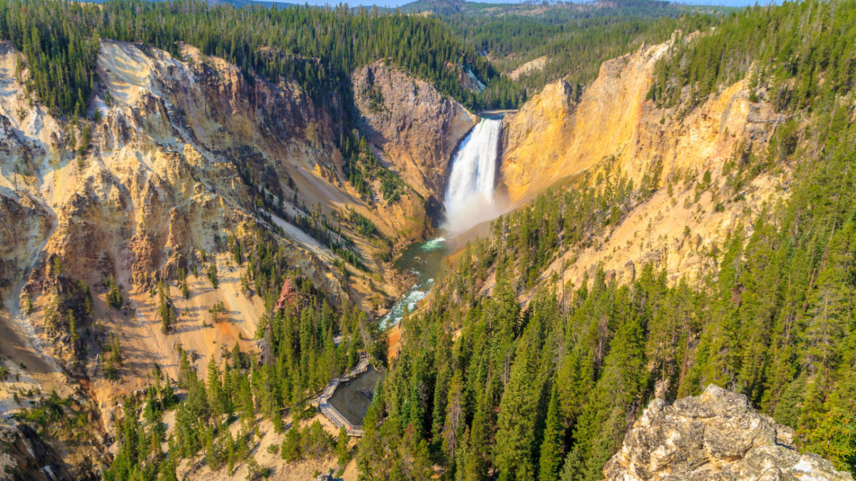 <p>Sometimes described as “bottle-green” here, the Yellowstone River roars over two impressive drops, but the lower one, at a little over 300’, is the more spectacular. You can view it from afar or, if you’re okay with getting wet, up close via two different trails.</p>