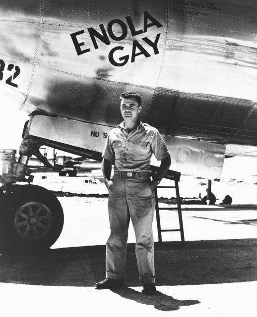 Paul Tibbets next to the Boeing B-29 Superfortress <a>Enola Gay</a> that he piloted during the atomic bombing mission over Hiroshima, Japan, 1945. (Photo Credit: Bettmann / Getty Images)