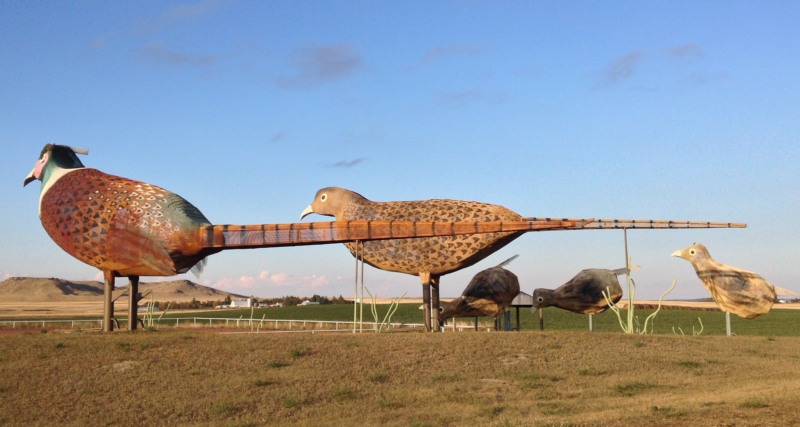 <p><span>The Enchanted Highway in North Dakota offers a unique driving experience with its series of large scrap metal sculptures. Stretching 32 miles from Gladstone to Regent, these sculptures, including “Geese in Flight” and “The Tin Family,” are among the world’s largest. </span></p> <p><span>Created by local artist Gary Greff to revive his hometown of Regent, the sculptures turn the highway into an open-air art gallery. The drive itself is a peaceful journey through North Dakota’s picturesque landscapes.</span></p> <p><b>Insider’s Tip: </b><span>End your drive in Regent to visit the Enchanted Highway Gift Shop.</span></p> <p><b>When To Travel: </b><span>Best visited in the summer or early fall for pleasant driving conditions.</span></p> <p><b>How To Get There: </b><span>Starts at Exit 72 on I-94 near Gladstone and ends in Regent.</span></p>