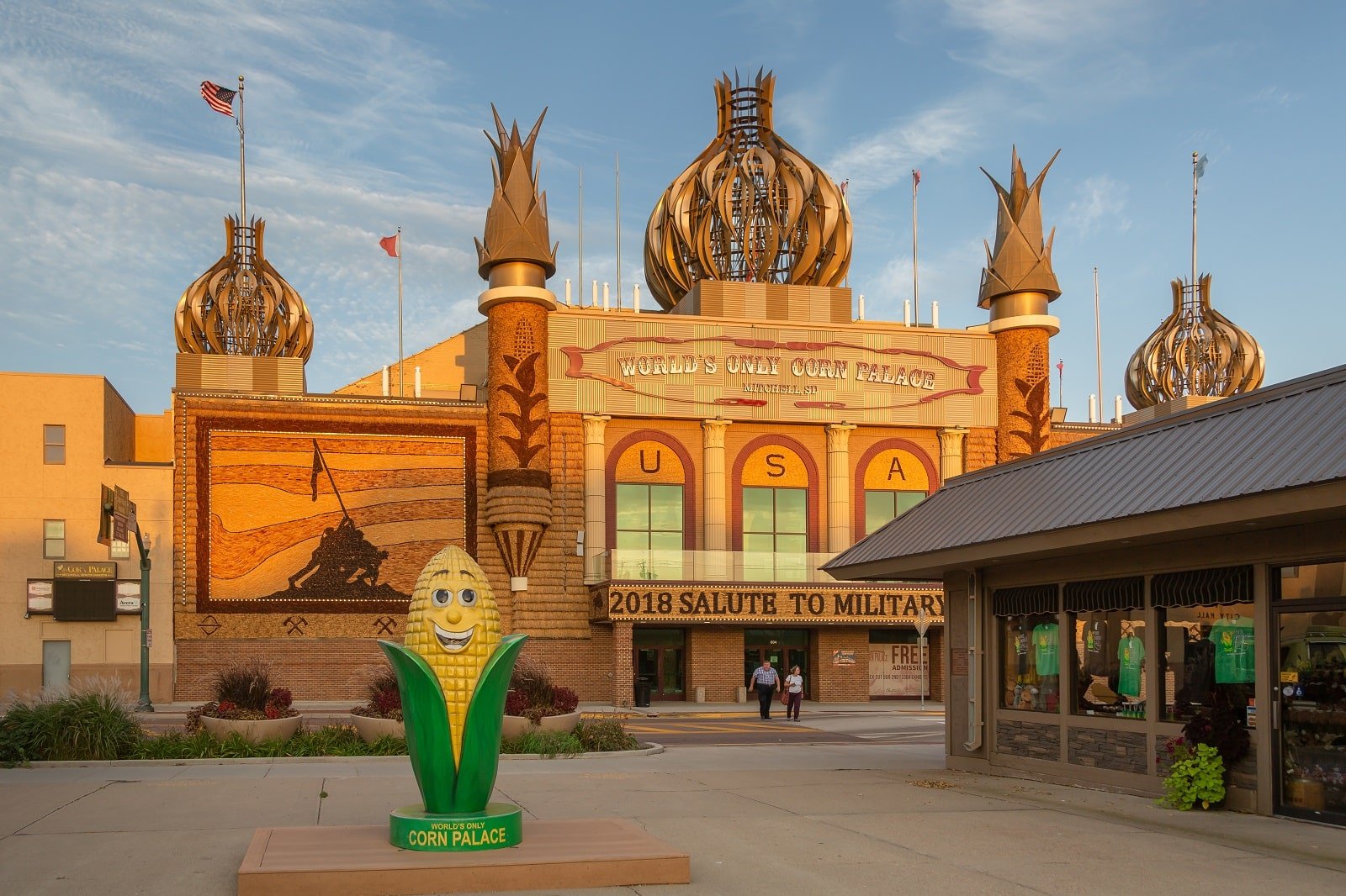 <p><span>The Corn Palace in Mitchell, South Dakota, is a unique American landmark decorated annually with murals made entirely of corn and other grains. This tradition, dating back to 1892, celebrates South Dakota’s rich agricultural heritage.</span></p> <p><span>The designs are intricate and change yearly, making each visit a new experience. Inside, the palace is a multi-use center with exhibits on its history and the corn mural process. It’s a fascinating stop for those interested in folk art and agrarian traditions.</span></p> <p><b>Insider’s Tip: </b><span>Check out the annual Corn Palace Festival in late August for extra festivities.</span></p> <p><b>When To Travel: </b><span>Open year-round, but the new murals are usually completed by late August.</span></p> <p><b>How To Get There: </b><span>Situated in downtown Mitchell, it is easily accessible from I-90.</span></p>