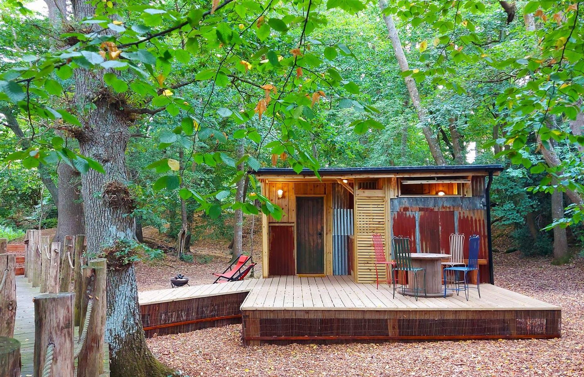 <p>Known as Browns Shack, this handmade cabin lies in the Rother district of East Sussex, England, in a leafy woodland. Described on the <a href="https://www.airbnb.co.in/rooms/684782634554494141?source_impression_id=p3_1707894175_5vym8GzdiIOJpUlK">Airbnb listing</a> as both quirky and rustic, the small wooden hut comes with everything you could need for a comfortable weekend away.</p>