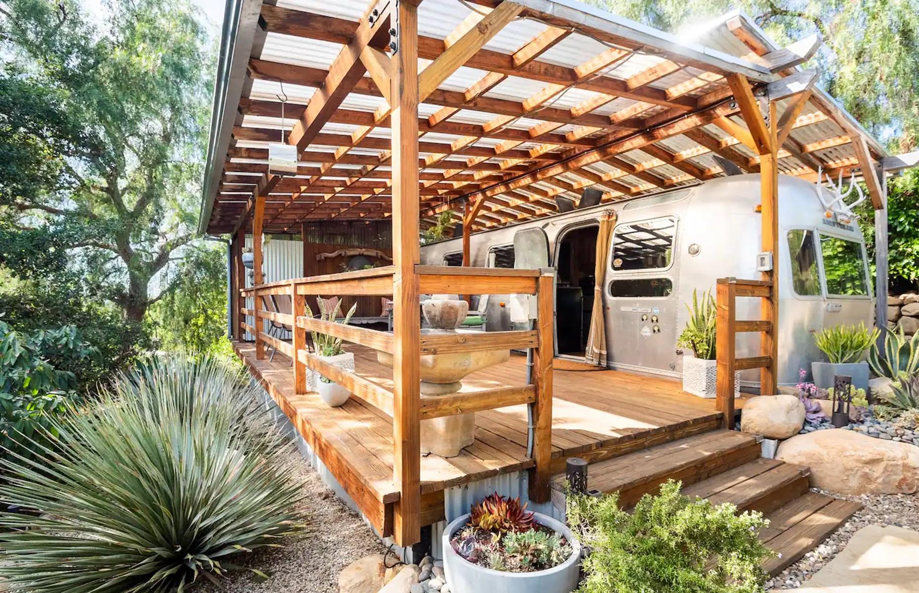 <p>Secluded on a five-acre organic farm in Carpinteria, California this <a href="https://www.airbnb.com/rooms/20068886?source_impression_id=p3_1650651879_I8BNJHRQ73ADFUK3&irgwc=1&irclid=URN0QOUXmxyPTFJwyvTSg26xUkHwtUSpHQeFXU0&ircid=4273&sharedid=&af=126295512&iratid=9627&c=.pi73.pk4273_249354&irparam1=">converted 1974 Airstream</a> is unbelievably cool. The pad belongs to Delia, who decided to create her own Airbnb to help boost her income. "When you're young, work for your land, but when you're old, let your land work for you," she said during a <a href="https://www.youtube.com/watch?v=wtyN_10Qwy4">YouTube house tour</a>.</p>  <p>Amazingly, almost everything inside is either salvaged, upcycled or handmade, including the curtains, which Delia created from old tea towels and pashminas.</p>
