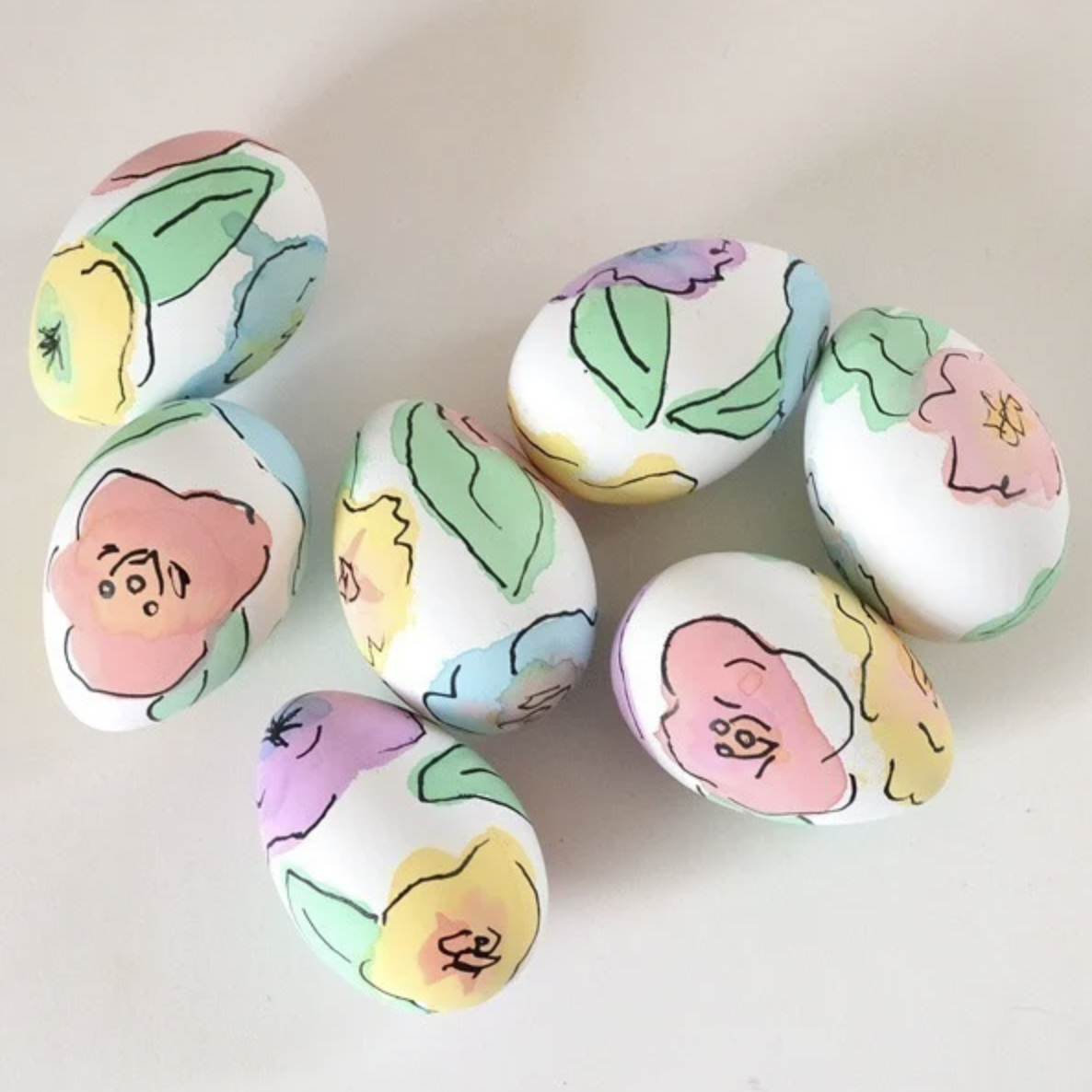 <p>Darling floral designs in the prettiest pastel hues are what springtime dreams are made of! You can copy them yourself with liquid food coloring and black sharpie marker. </p><p><strong>Get the tutorial at <a href="https://www.dreamalittlebigger.com/post/floral-eggs-easter.html">Dream A Little Bigger</a>.</strong></p>