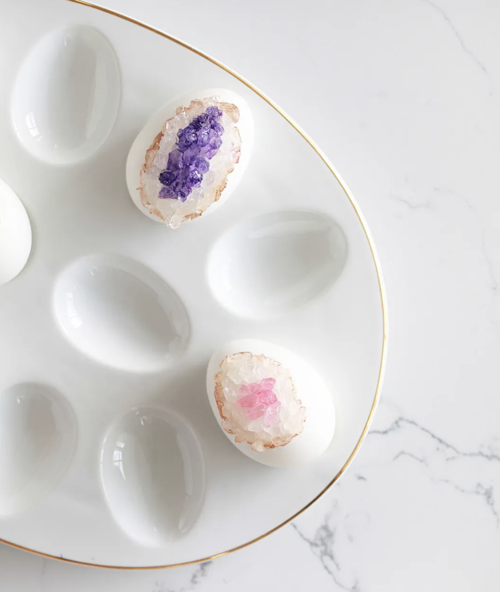 <p> Make your egg a real "gem." 😂 It's easy to create this gorgeous geode display with simple rock candy. Watch out for the kids though, they'll want to lick them clean!</p><p><strong>Get the tutorial at <a href="https://poshlittledesigns.com/2018/03/26/geode-easter-eggs-diy/">Posh Little Designs</a>.</strong></p>
