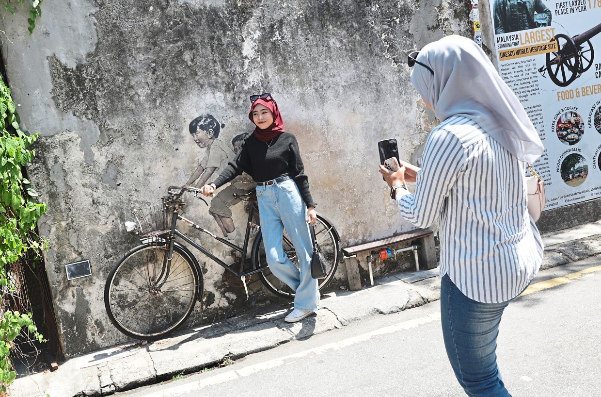 zacharevic to repaint fading iconic artwork, says wong