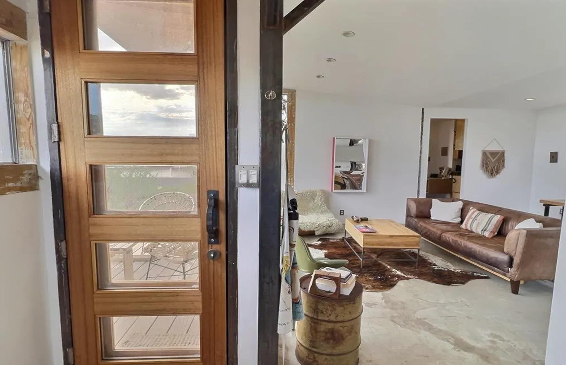 <p>Built in 2015, <a href="https://www.realtor.com/news/unique-homes/2-shipping-container-home-in-marfa-tx-asks-525k/">the property</a> blends both modern design and rustic charm. It's also surprisingly spacious, with 933 square feet of living space. There's an open-plan lounge, dining space, and kitchen, as well as two bedrooms, two bathrooms and two exterior decks for soaking up the scenery.</p>