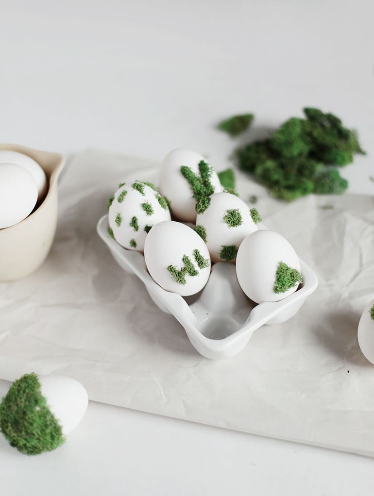 <p>These moss-covered eggs would fit right in with a nature-themed Easter tablescape. To achieve this look, dip a paint brush in glue, paint your desired designs onto the eggs, and then press small pieces of moss into the glue to bring your designs to life. </p><p><strong>See more at <a href="https://themerrythought.com/diy/diy-moss-design-eggs/">The Merrythought</a>.</strong> </p>