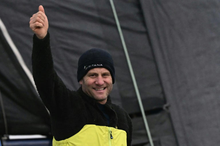 French skipper Charles Caudrelier celebrates after winning the Ultim Challenge, the first solo round the world race for multi-hull boats