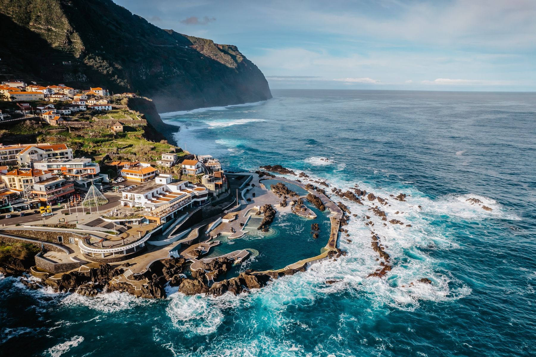 <p>Often referred to as “Europe’s Hawaii,” the Portuguese island of <a href="https://visitmadeira.com/en/" class="CMY_Link CMY_Valid" rel="noreferrer noopener">Madeira</a> seduces visitors with its breathtakingly diverse landscapes and various activities. Activities include exploring the <a href="https://whc.unesco.org/en/tentativelists/6230/" class="CMY_Link CMY_Valid" rel="noreferrer noopener">levadas</a> that wind through lush forests and venturing to the summit of <a href="https://visitmadeira.com/en/where-to-go/madeira/madeira-peaks/pico-do-areeiro/" class="CMY_Link CMY_Valid" rel="noreferrer noopener">Pico do Areeiro</a> for exceptional views of the island. Madeira is also famous for its fortified wine and traditional celebrations, such as the Flower Festival. With mild weather year-round, this island is a magical destination offering dreamlike experiences from day one.</p>