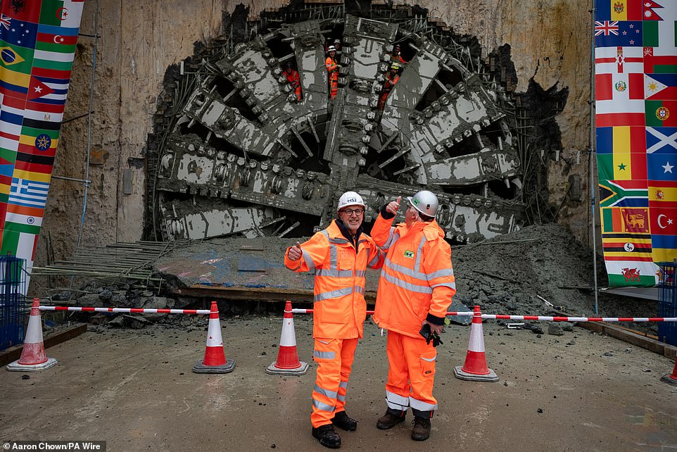 breakthrough! hs2 workers celebrate as machine digging controversial railway's longest-ever tunnel completes 10-mile journey beneath the chiltern hills