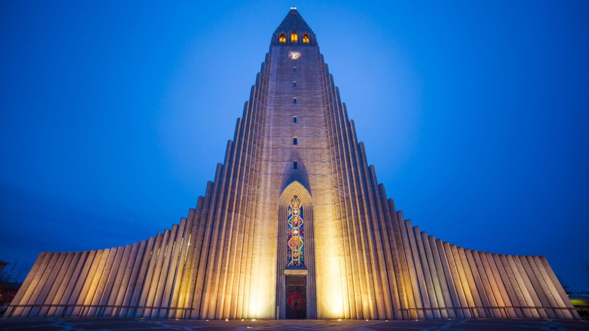 <p>This cathedral is in the center of Reykjavik and has a tower that is 240 feet tall. It took 41 years to build this church, which was finished in 1986. It’s the largest church in Iceland and is the main symbol of this capital city. Getting into the church is free, but if you want to climb up the tower, you must pay a small fee. The view from the tower is amazing. You can see all the buildings in the city and, on a clear day, even the ocean.</p><p>The architectural style of this church is classified as expressionist neo-gothic, which means that it uses other styles, not just gothic. There’s a statue in front of the church of the explorer Leif Erikson that was a gift from the US to Iceland and has stood here even longer than the church has. Inside the church are two huge organs and a statue of Jesus that depicts him receiving the Holy Ghost after His baptism.</p>