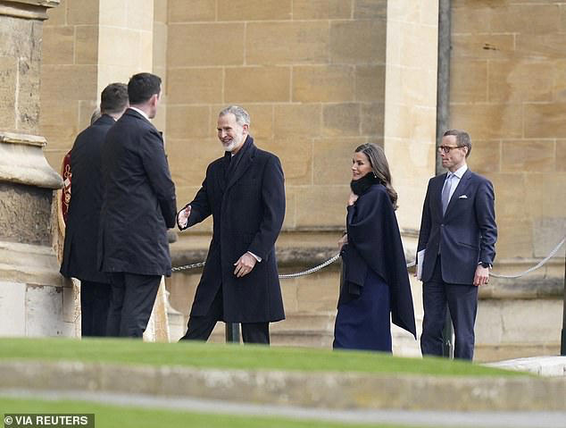 Queen Letizia of Spain walks arm-in-arm with husband King Felipe VI as ...