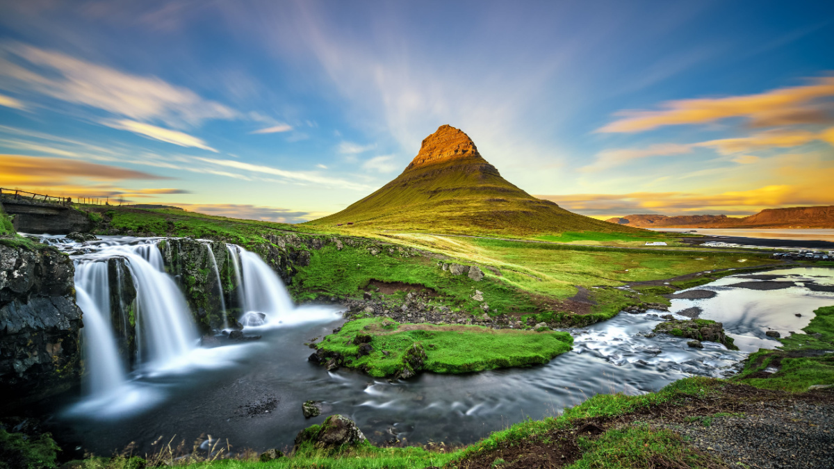 <p>Only 1,520’, this Icelandic peak proves that bigger is not always better. Resembling a cone from some directions and a cathedral from others, the peak juts up its flat surroundings and draws all attention to it. A three-streamed waterfall nearby creates the perfect framing for photographers.</p>