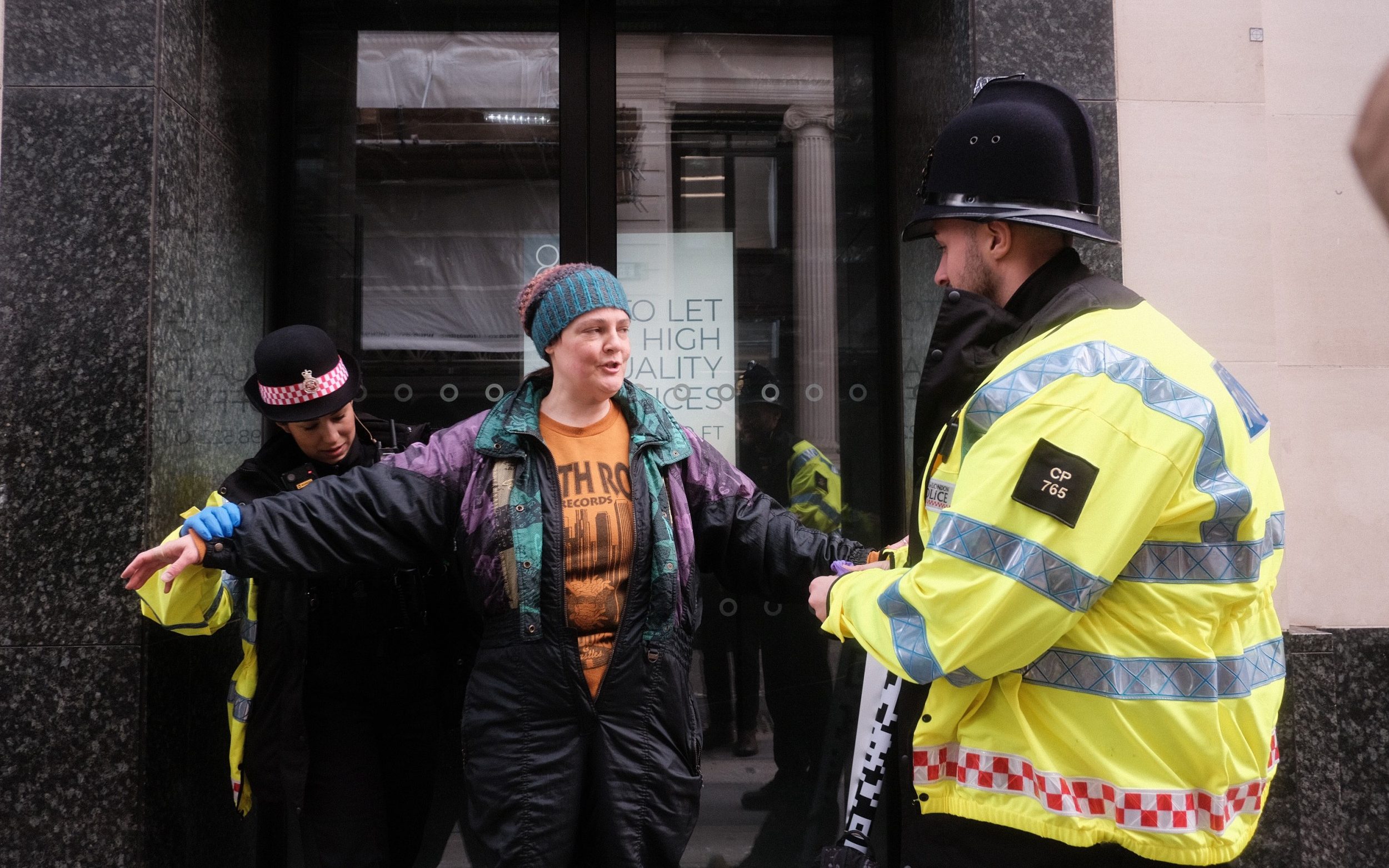 microsoft, extinction rebellion protesters storm walkie talkie dressed in suits