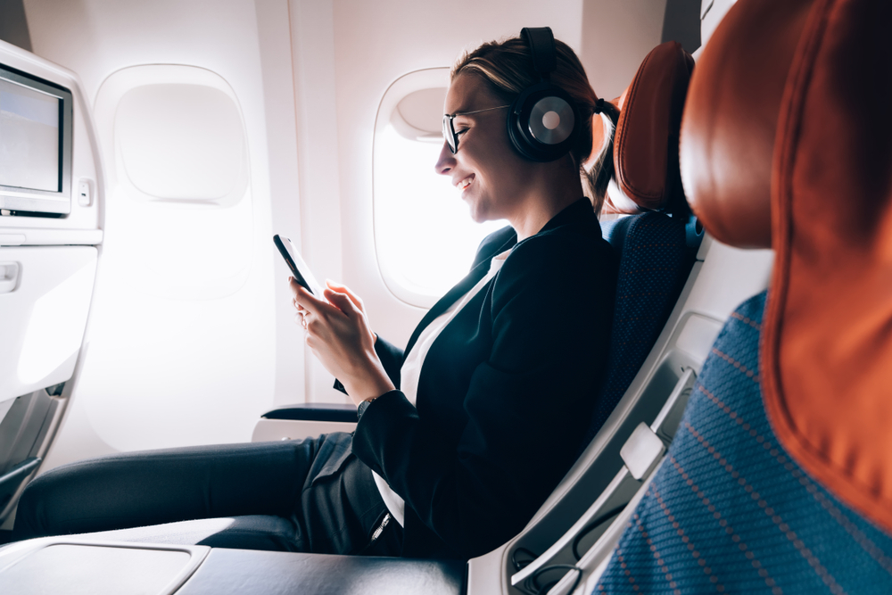 <p>Invest in a good pair of noise-canceling headphones to drown out the engine noise and chatter, making it easier to relax or sleep. They can also enhance your entertainment experience by providing clear audio.</p>