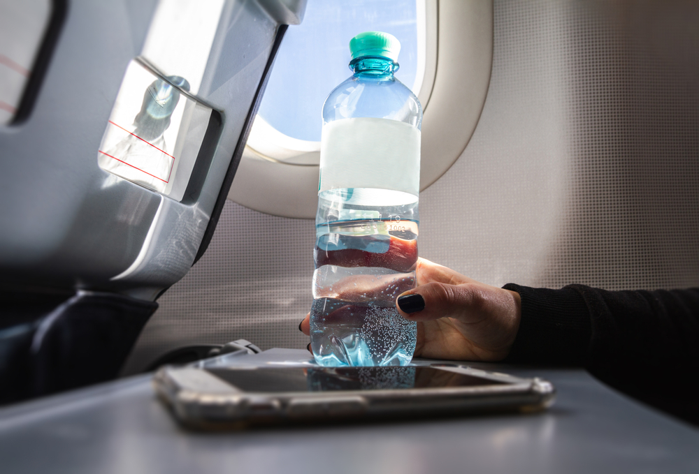 <p>Cabin air is notoriously dry, so staying hydrated is crucial. Bring a refillable water bottle to fill up after security checks. Avoid excessive alcohol or caffeine, as these can exacerbate dehydration and jet lag.</p>