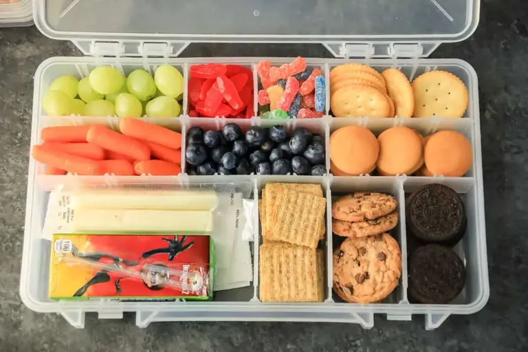 Keep everyone happy on the go with this guide to creating a balanced and delicious travel snack box filled with sweet, salty, and healthy options for adults and kids alike.