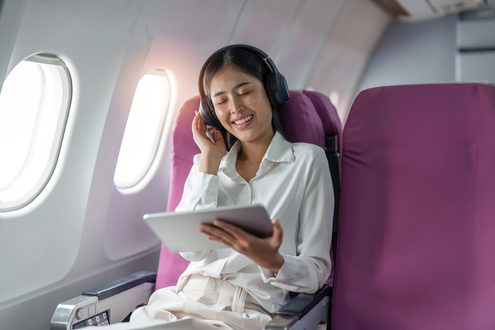 <p>Long flights can be tedious, so load your device with movies, music, games, or books. Don’t rely solely on in-flight entertainment, as systems can be unpredictable. Ensure your devices are charged and consider bringing a portable charger.</p>